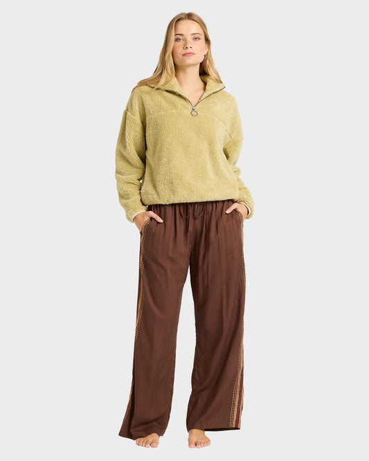Image of a model wearing Pants. Product name - Billabong Womens Vacay Mode Elastic Pants Teak in Teak colour by brand - Billabong