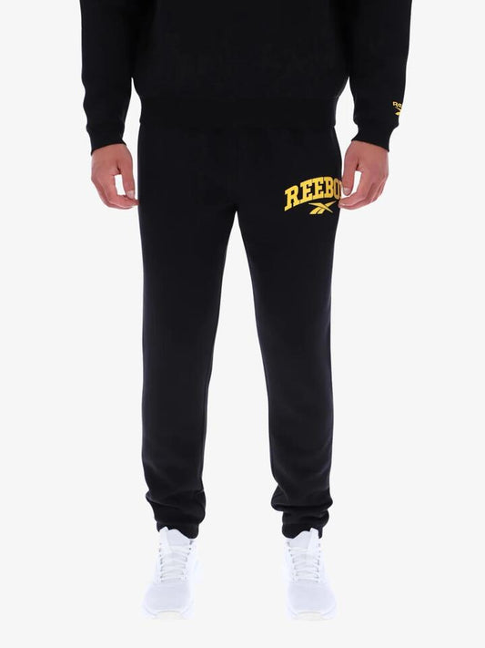 Image of a model wearing Pants. Productname: Reebok Nellie Jogger Pants in Black colour by brand - Reebok
