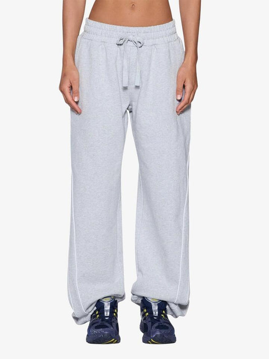 Image of a model wearing Pants. Productname: Ksubi Carter Wide Trakpants in Grey Marle colour by brand - Ksubi