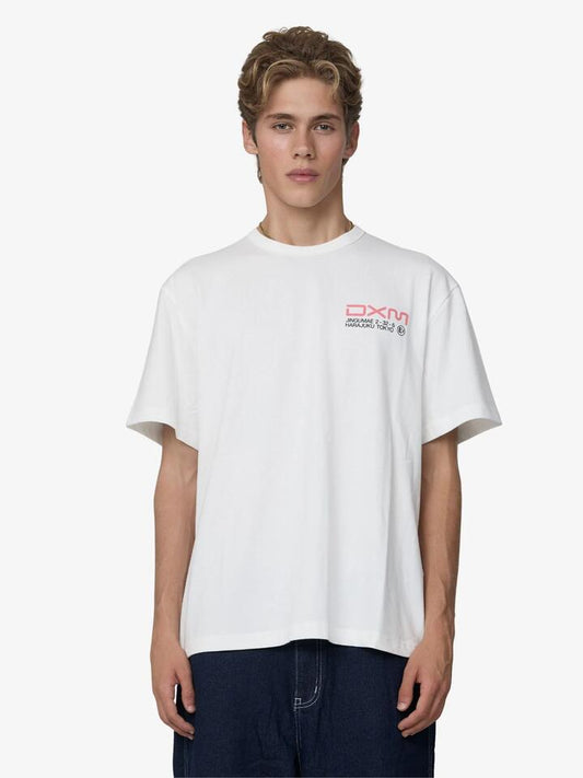 Image of a model wearing Tops. Productname: Deus Departed Tee in Vintage White colour by brand - Deus