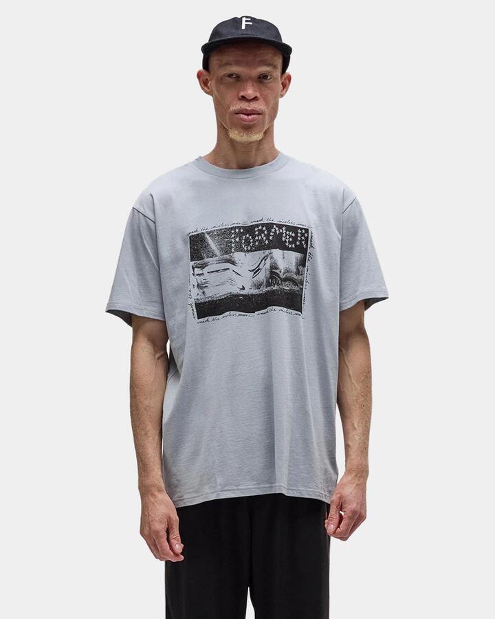 Image of a model wearing Tops. Productname: former Mens Establish T-Shirt Cement - in Cement colour by brand - Former