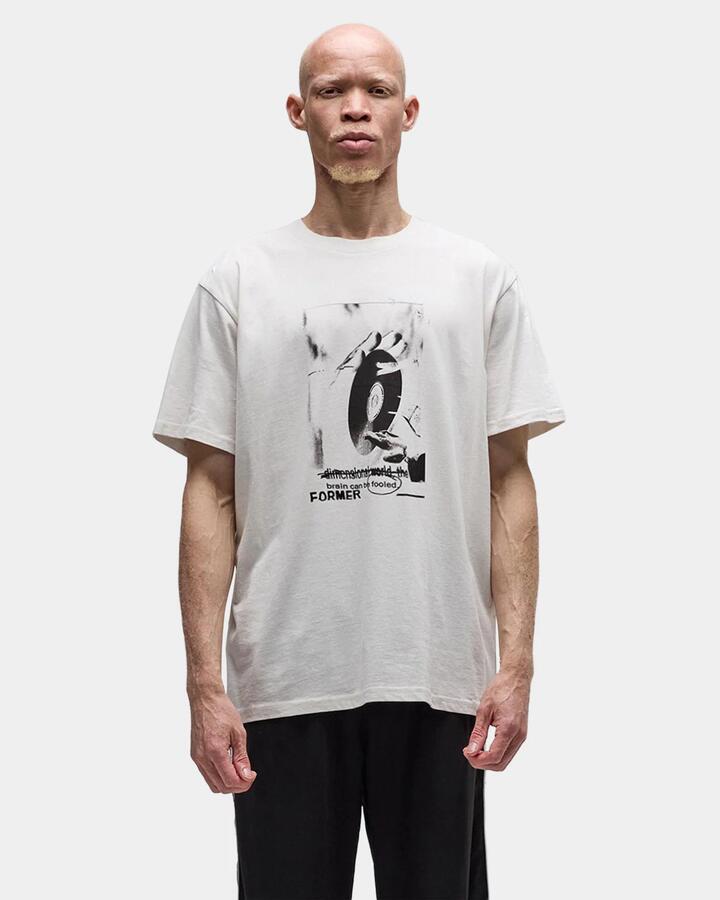Image of a model wearing Tops. Productname: former Mens Cease T-Shirt Bone - in Bone colour by brand - Former