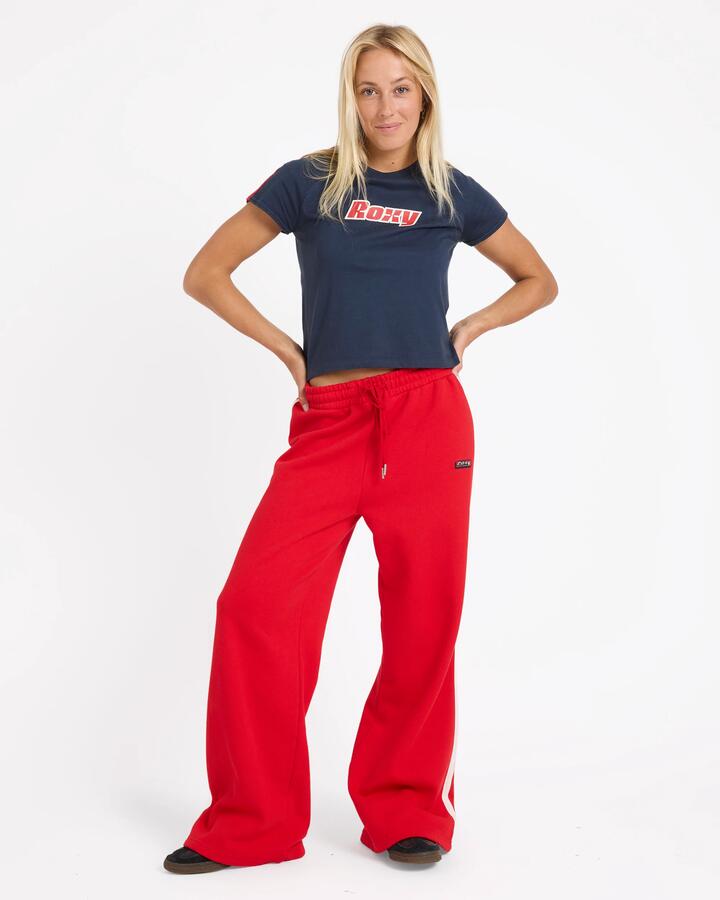 Image of a model wearing Pants. Product name - Roxy Womens Sketch Trackpants Rio Red in Rio Red colour by brand - Roxy