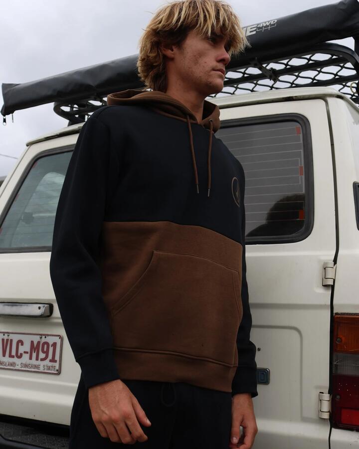 Image of a model wearing Outerwear. Product name - Volcom Mens Stone Cb Pullover Hoodie Dark Earth in Dark Earth colour by brand - Volcom