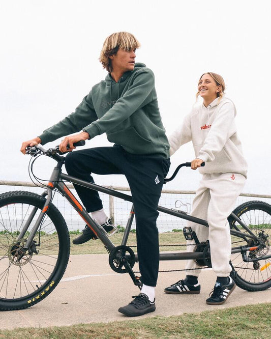 Image of a model wearing Pants. Productname: volcom Mens Vologo Trackpants Black - in Black colour by brand - Volcom