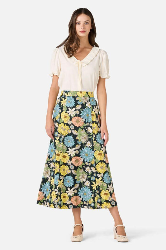 Image of a model wearing Skirts. Product name - Leonie Floral Midi Skirt in Deep Green colour by brand - Princess Highway