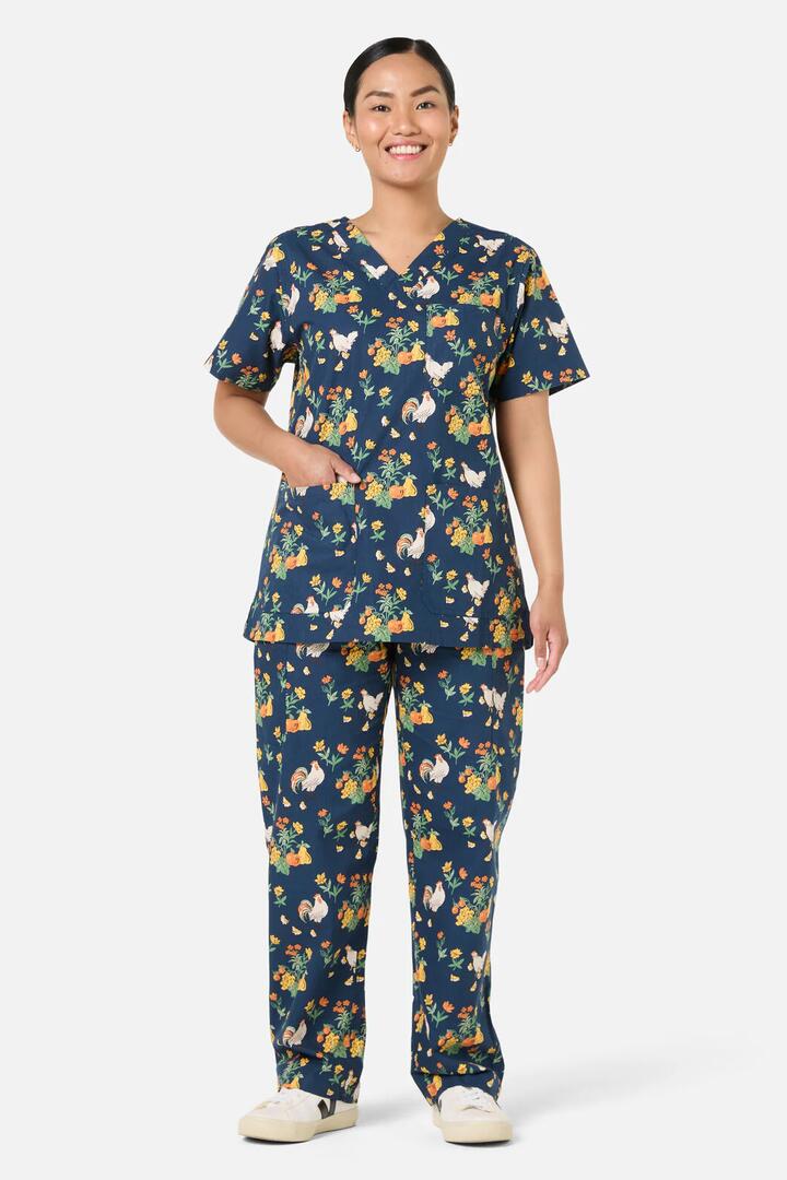 Image of a model wearing Uniforms & Workwear. Productname: Chickens Scrub Set in Navy colour by brand - Scrubs With Love