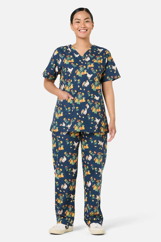 Image of a model wearing Uniforms & Workwear. Productname: Chickens Scrub Set in Navy colour by brand - Scrubs With Love