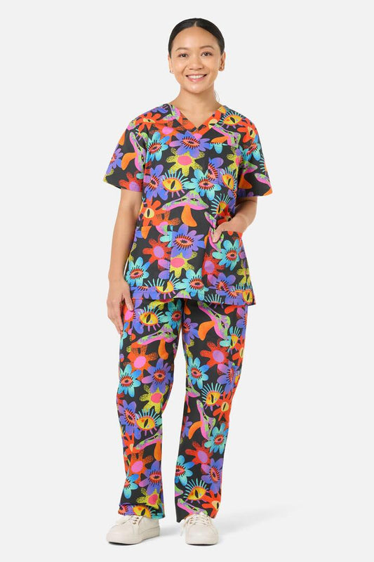 Image of a model wearing Uniforms & Workwear. Product name - Crazy Flower Scrub Set in Multi colour by brand - Scrubs With Love