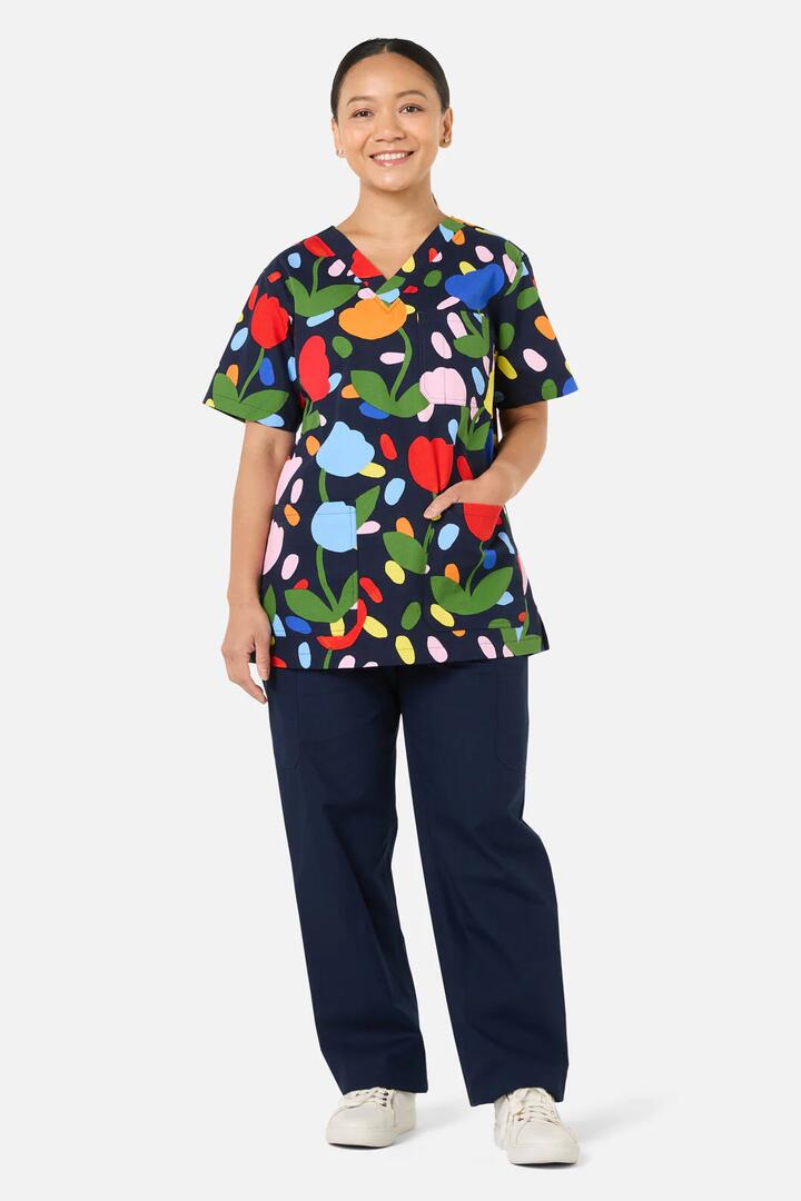 Image of a model wearing Uniforms & Workwear. Product name - Confetti Top & Pant Scrub Set in Navy colour by brand - Gorman