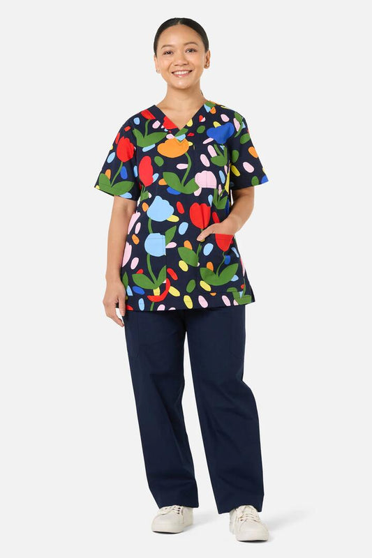 Image of a model wearing Uniforms & Workwear. Product name - Confetti Top & Pant Scrub Set in Navy colour by brand - Gorman