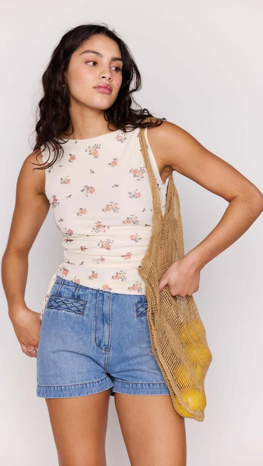 Image of a model wearing Tops. Product name - Cream Floral Boat Neck Mesh Top in Ditzy Floral colour by brand - MINKPINK