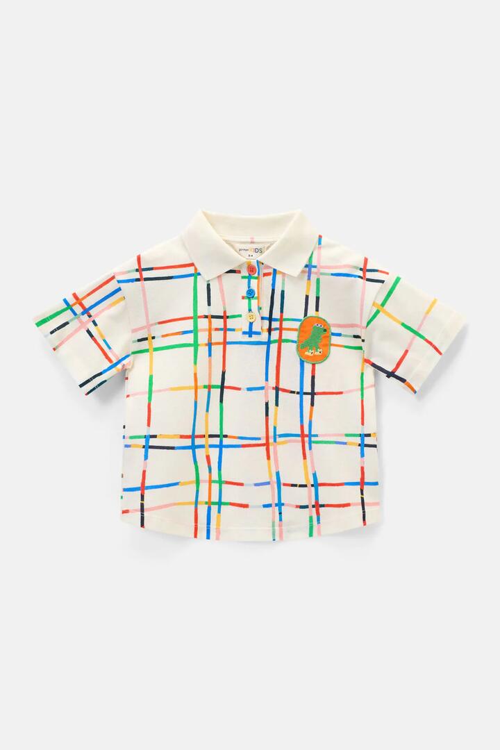Image of a model wearing Tops. Product name - Rex Check Kids Polo Top in Cream colour by brand - Gorman