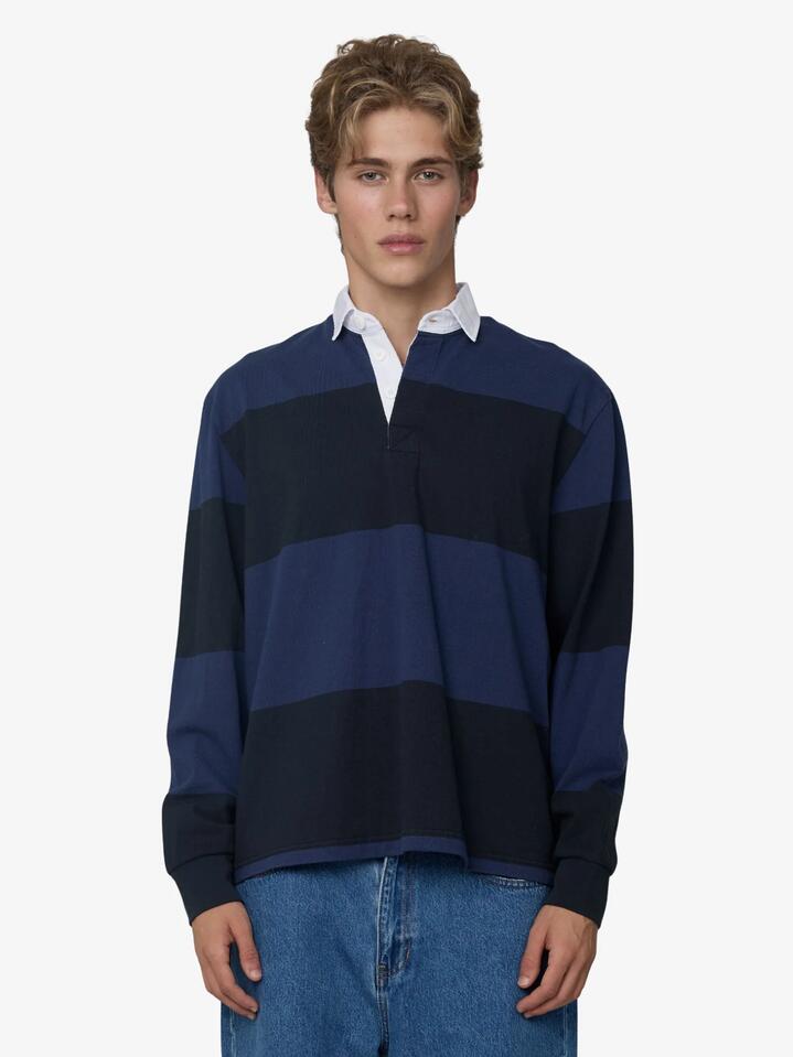 Image of a model wearing Tops. Productname: Article One Tate Rugby in Black/Navy colour by brand - Article One