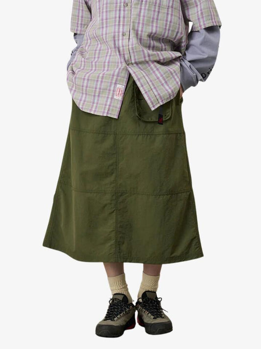 Image of a model wearing Skirts. Productname: Gramicci Nylon Utility Skirt in Olive colour by brand - Gramicci