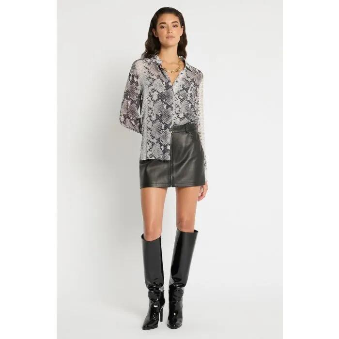 Image of a model wearing Skirts. Productname: Across The Street Mini Skirt in Black colour by brand - sass and bide