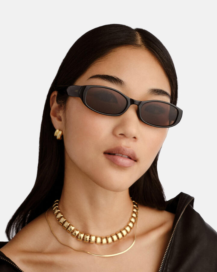 Image of Sunglasses. Productname: Aire Caellum Sunglasses: Black - Women's Sunglasses in Black colour by brand - Novo