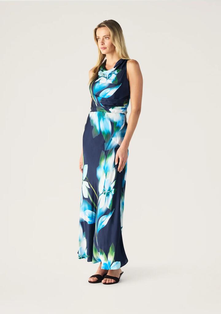 Image of a model wearing Tops. Productname: Bloom Halter Neck Dress | MOS The Label in Bloom Print colour by brand - MOS The Label
