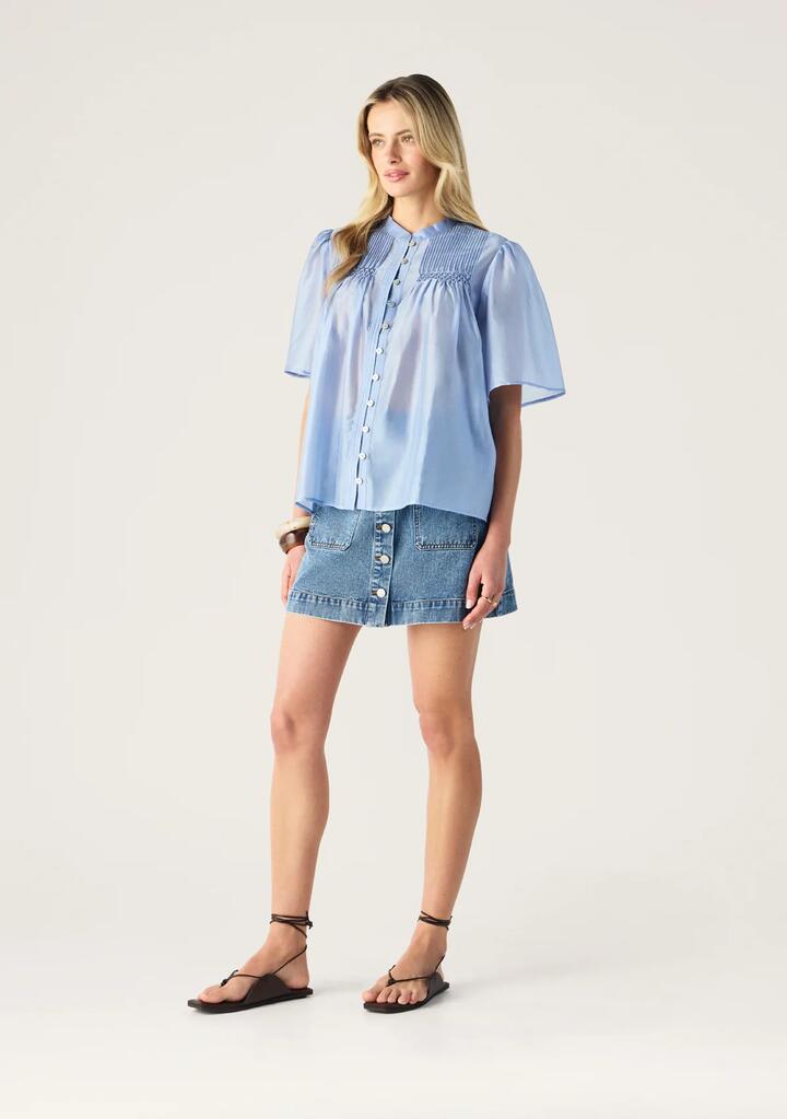 Image of a model wearing Tops. Productname: Romy Short Sleeve Blouse | MOS The Label in Blue Aura colour by brand - MOS The Label