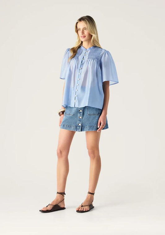 Image of a model wearing Tops. Productname: Romy Short Sleeve Blouse | MOS The Label in Blue Aura colour by brand - MOS The Label