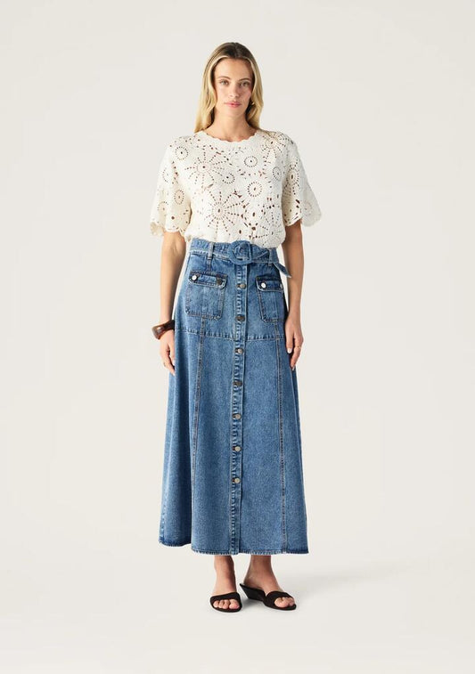 Image of a model wearing Skirts. Productname: Aveline Denim Midi Skirt | MOS The Label in Light Indigo colour by brand - MOS The Label