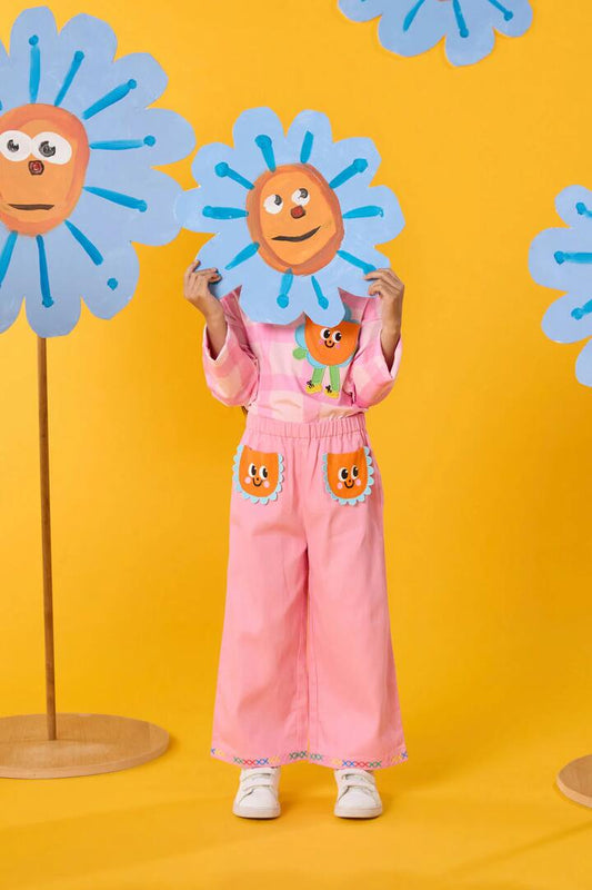 Image of a model wearing Pants. Product name - Daisy Pocket Kids Pants in Pink colour by brand - Gorman