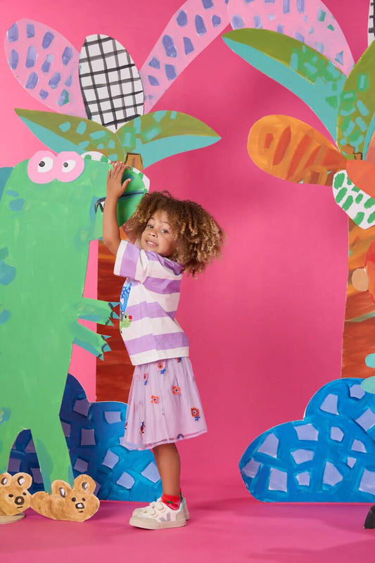 Image of a model wearing Skirts. Product name - Hyper Embroidery Kids Skirt in Lilac colour by brand - Gorman