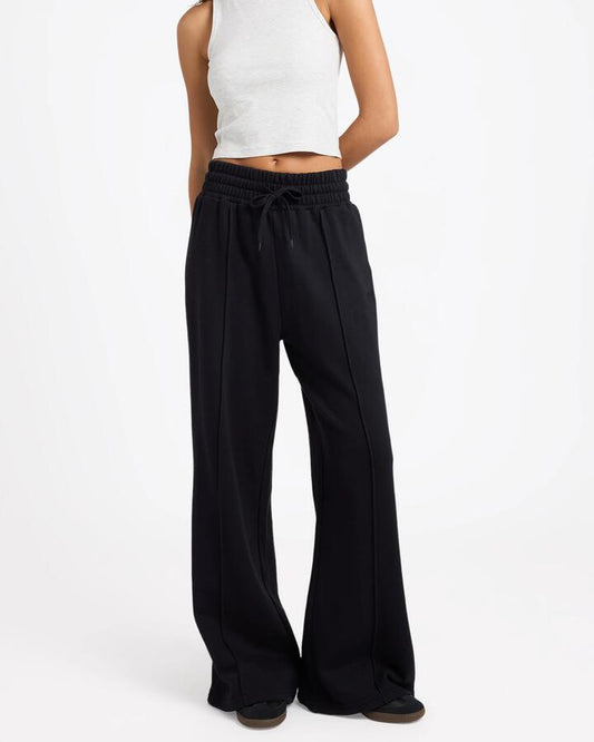 Image of a model wearing Outerwear. Product name - Von Zipper Womens Dahlia Fleece Pants Black in Black colour by brand - Von Zipper