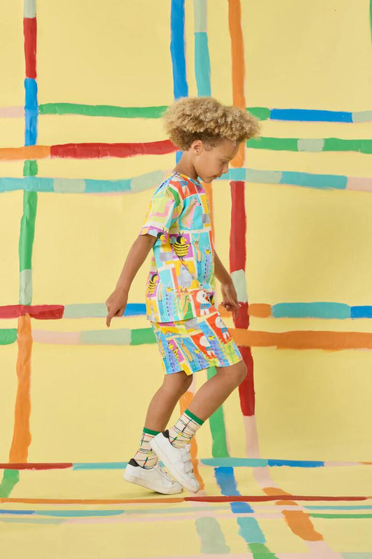 Image of a model wearing Shorts. Product name - Believe Patch Kids Shorts in Multi colour by brand - Gorman