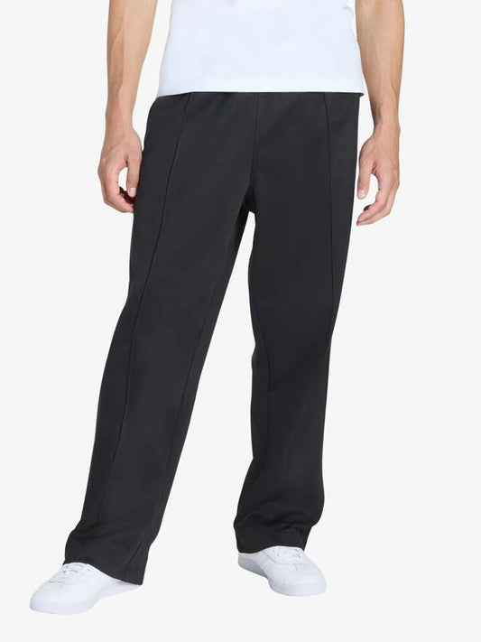 Image of a model wearing Pants. Productname: Adidas Baggy Track Pants in Black/Black colour by brand - Adidas