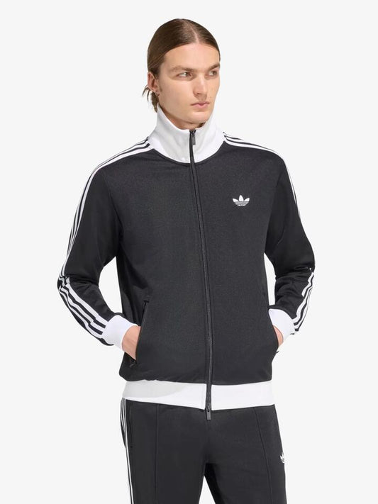Image of a model wearing Tops. Productname: Adidas Classic Track Top in Black colour by brand - Adidas