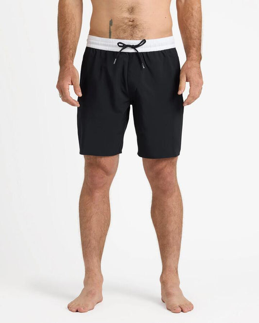 Image of a model wearing Shorts. Productname: Volcom Mens Jones Trunk 18" Swim Shorts Black - in Black colour by brand - Volcom