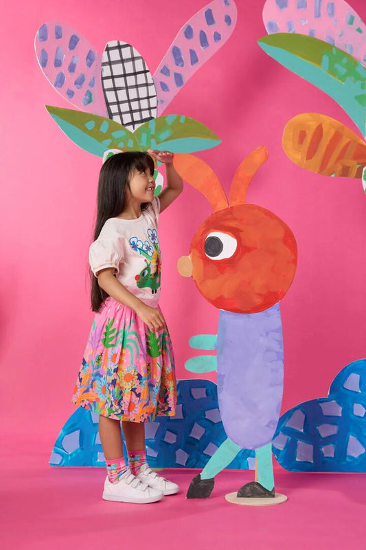 Image of a model wearing Skirts. Product name - Hyper Border Kids Skirt in Pink colour by brand - Gorman