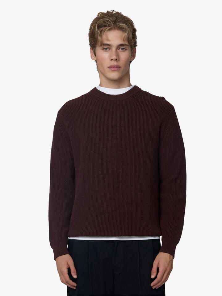 Image of a model wearing Outerwear. Productname: Article One Rib Knit Sweater in Chocolate colour by brand - Article One
