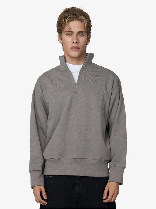 Image of a model wearing Tops. Productname: Article One Marvin Quarter Zip in Putty colour by brand - Article One