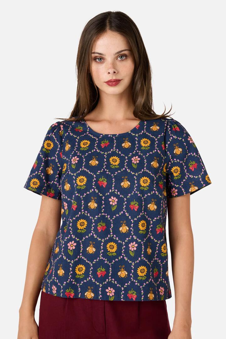 Image of a model wearing Tops. Productname: Honey Bee Hive Top in Navy colour by brand - Princess Highway