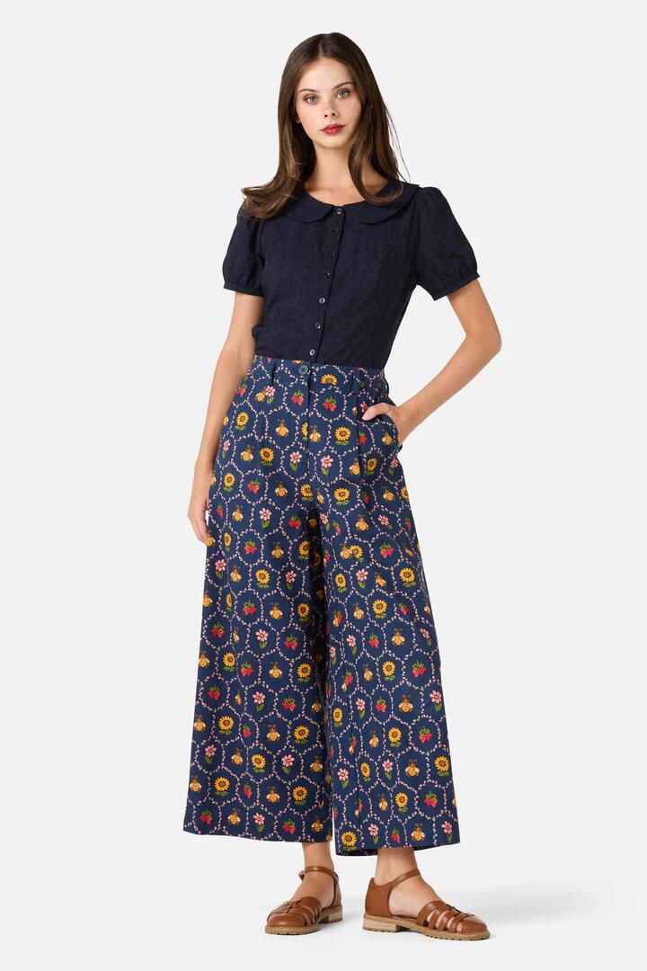 Image of a model wearing Pants. Productname: Honey Bee Hive Pant in Navy colour by brand - Princess Highway