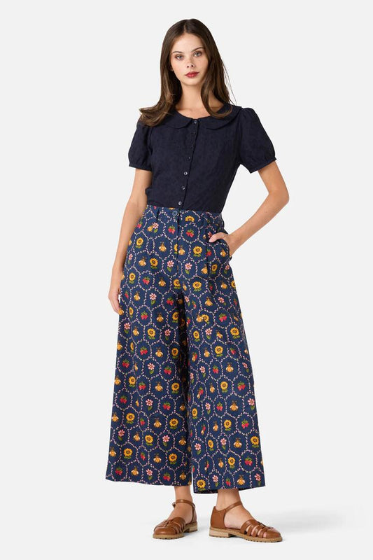 Image of a model wearing Pants. Productname: Honey Bee Hive Pant in Navy colour by brand - Princess Highway