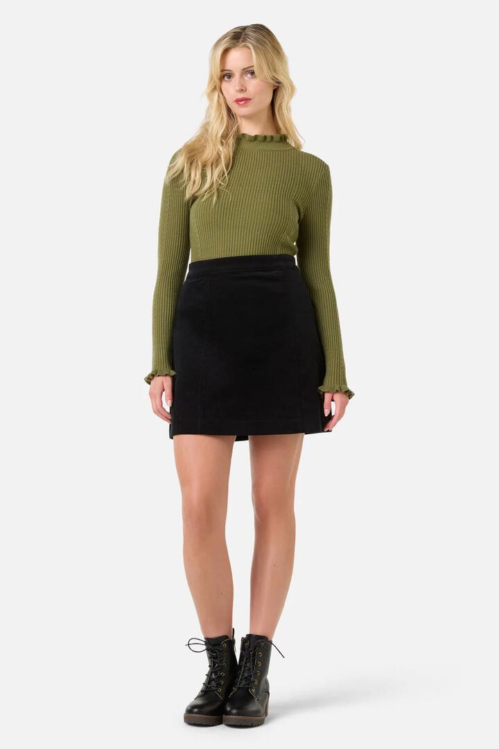 Image of a model wearing Skirts. Productname: Charlie Girl Cord Skirt in Olive colour by brand - Princess Highway