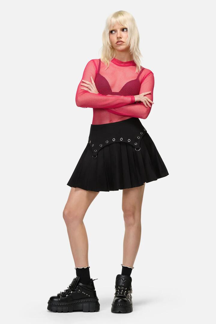 Image of a model wearing Skirts. Productname: Mischief Goth Eyelet Skort in Black colour by brand - Dangerfield