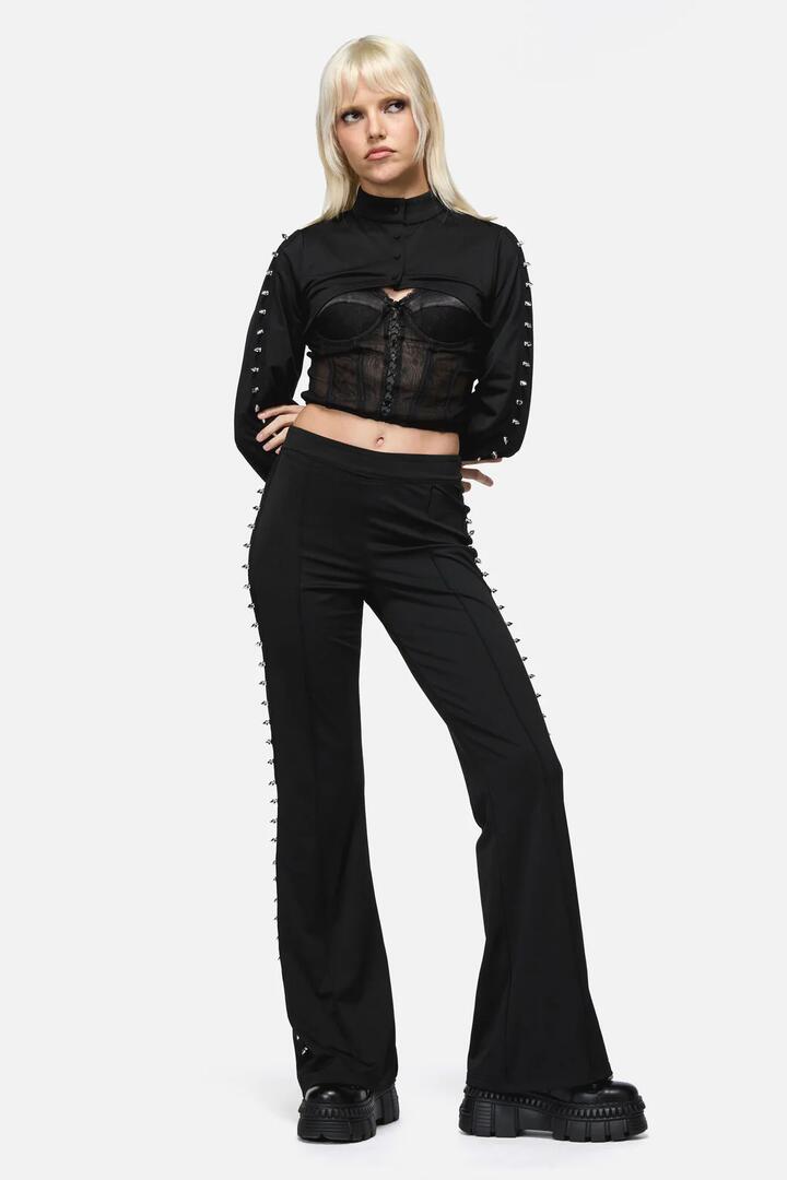 Image of a model wearing Pants. Productname: So Cynical V Front Legging in Black colour by brand - Dangerfield