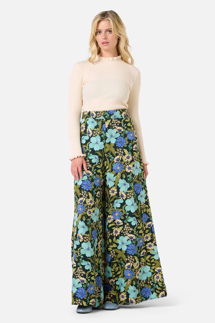 Image of a model wearing Pants. Productname: Gloria 70'S Floral Pant in Teal colour by brand - Princess Highway