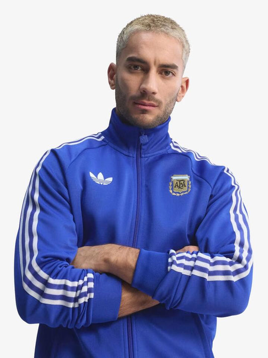Image of a model wearing Tops. Productname: Adidas Argentina Originals Track Top in Lucid Blue colour by brand - Adidas