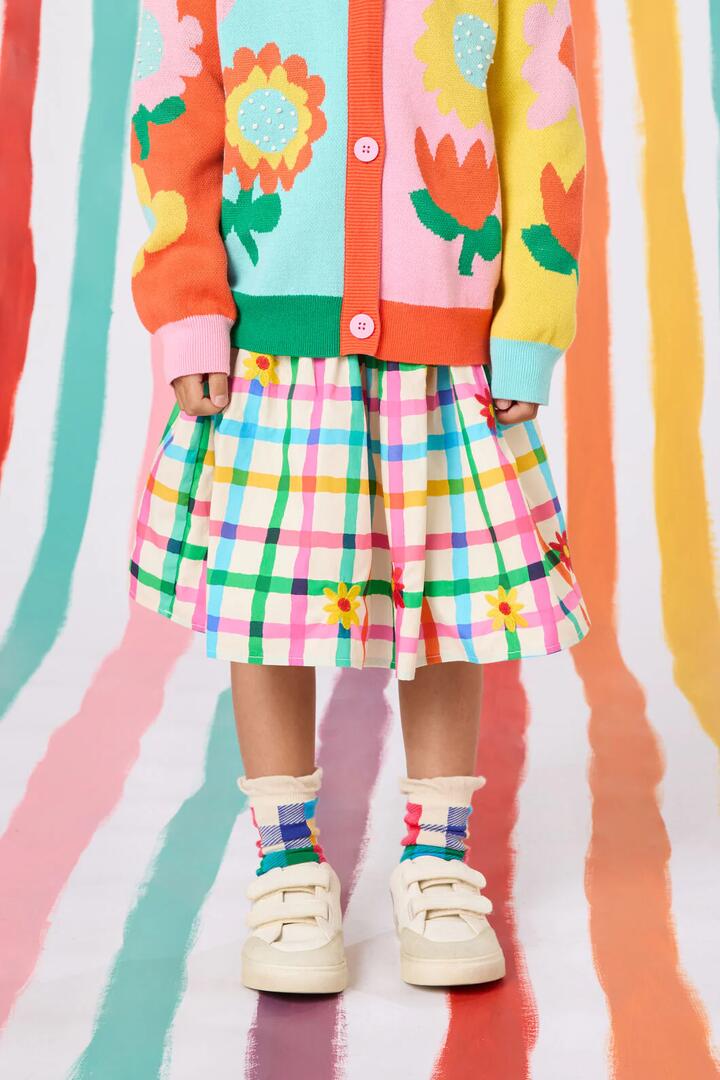 Image of a model wearing Skirts. Product name - Floral Embroidered Kids Skirt in Multi colour by brand - Gorman