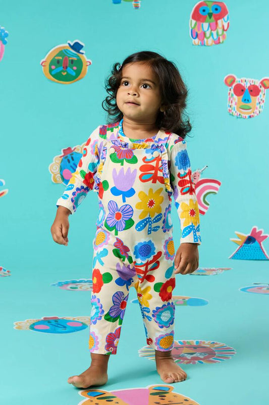 Image of a model wearing Pants. Productname: Geo Floral Baby Frill Overalls in Cream colour by brand - Gorman