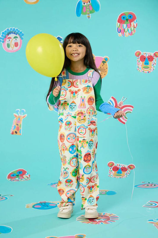 Image of a model wearing Pants. Product name - Gallery Kids Overalls in Cream colour by brand - Gorman
