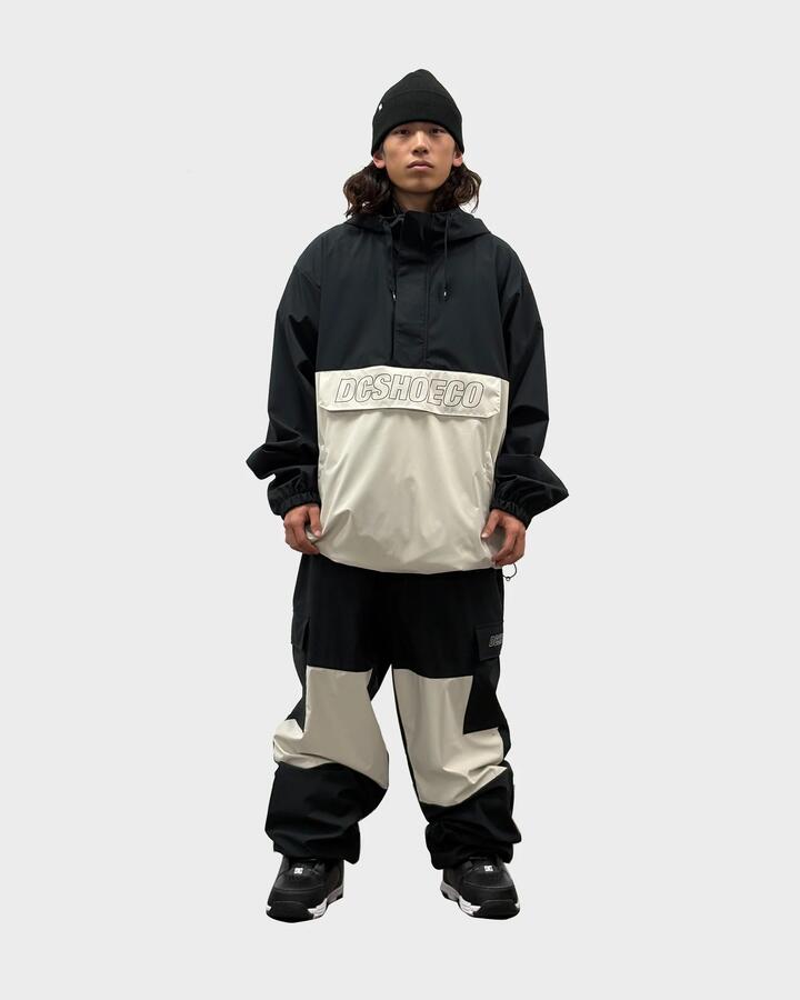 Image of a model wearing Outerwear. Productname: DC Shoes Mens 25 Dc Anorak Snow Jacket Black - in Black colour by brand - DC Shoes