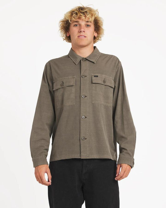 Image of a model wearing Tops. Productname: RVCA Mens Coas Over Long Sleeve Shirt Mushroom - in Mushroom colour by brand - RVCA