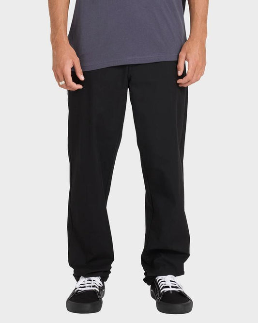 Image of a model wearing Pants. Productname: Billabong Mens Surftrek Plus Pants Black - in Black colour by brand - Billabong