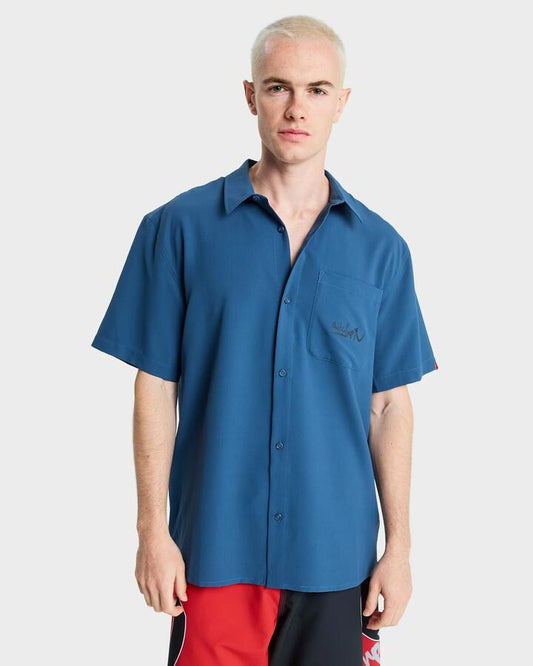 Image of a model wearing Tops. Productname: Quiksilver Mens Yg Lithium Short Sleeve Shirt Dark Denim - in Dark Denim colour by brand - Quiksilver
